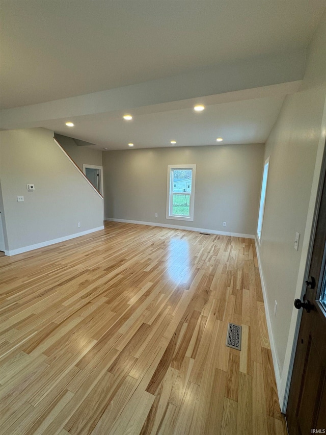 unfurnished room with light hardwood / wood-style floors