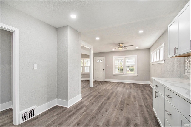 interior space featuring ceiling fan and hardwood / wood-style flooring