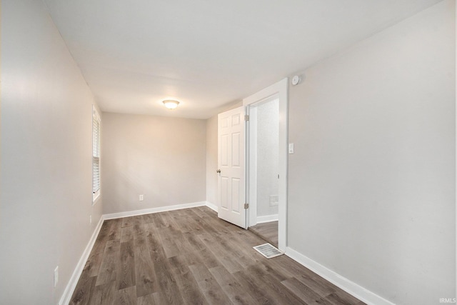 unfurnished room featuring wood-type flooring