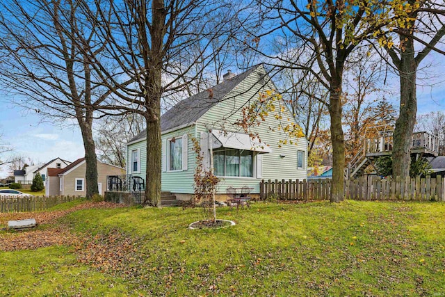 view of side of home featuring a lawn