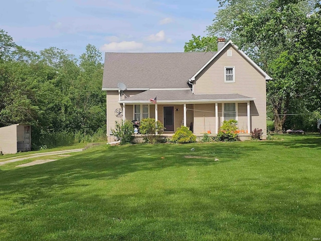 view of front of property with covered porch and a front yard