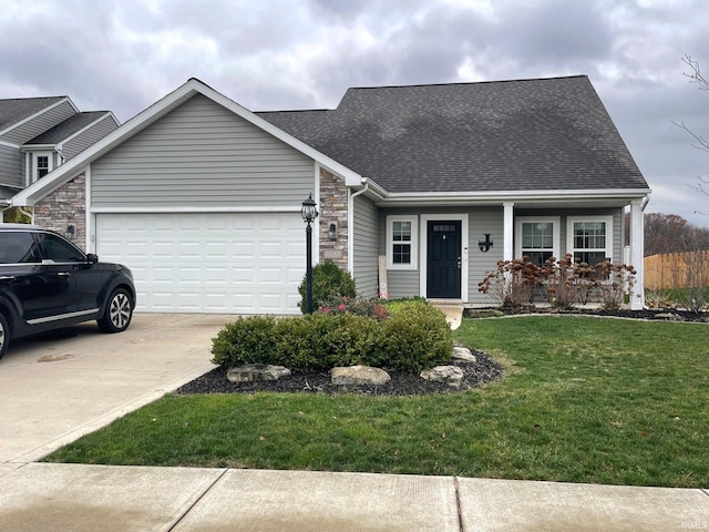 view of front of house featuring a garage and a front lawn