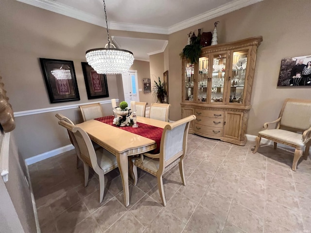 dining area featuring crown molding and a chandelier