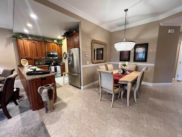 interior space featuring kitchen peninsula, stainless steel appliances, crown molding, decorative light fixtures, and an inviting chandelier