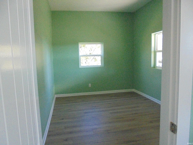 empty room featuring dark hardwood / wood-style flooring