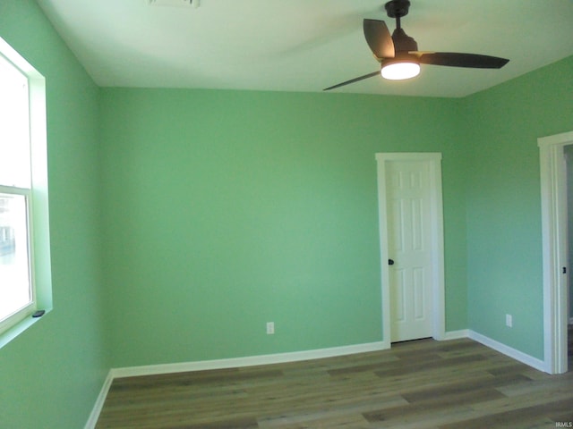 empty room featuring hardwood / wood-style floors and ceiling fan