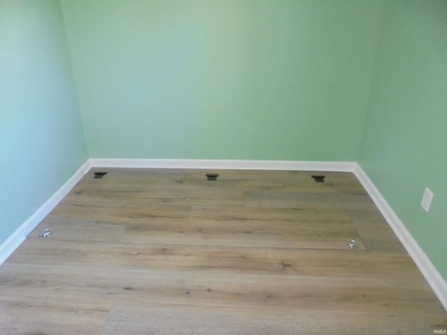 spare room featuring light wood-type flooring