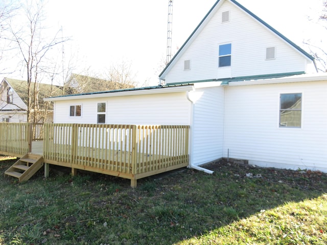 rear view of property featuring a deck