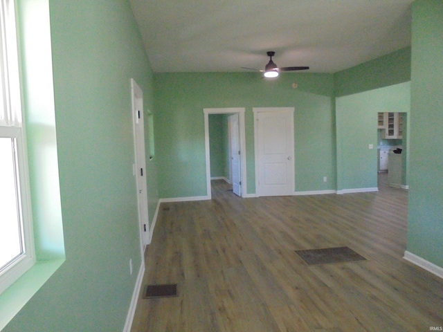 unfurnished room featuring dark hardwood / wood-style floors and ceiling fan