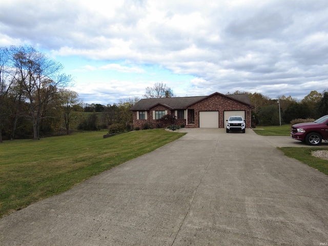 view of front of home with a garage and a front lawn