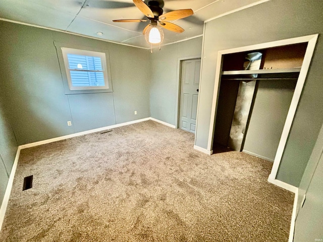 unfurnished bedroom with carpet floors and ceiling fan