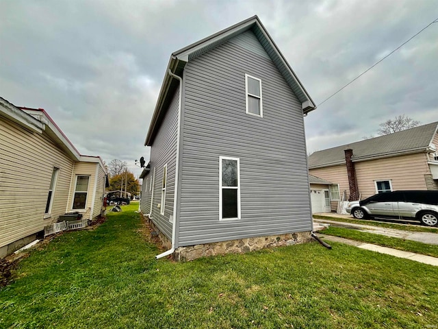 view of home's exterior with a yard