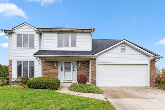 view of front facade featuring a garage and a front yard