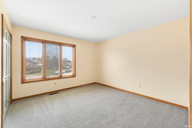 spare room with carpet floors