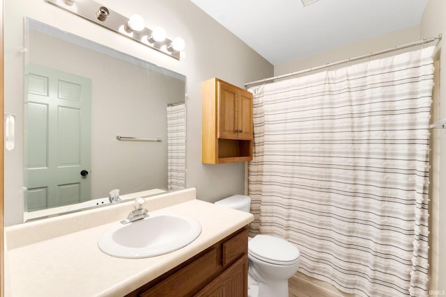 bathroom featuring vanity, toilet, wood-type flooring, and walk in shower