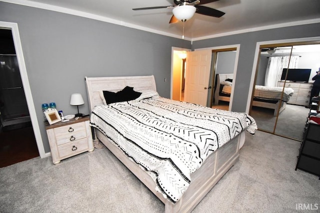 carpeted bedroom with ceiling fan and ornamental molding