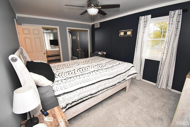 bedroom with light carpet, ceiling fan, and ornamental molding