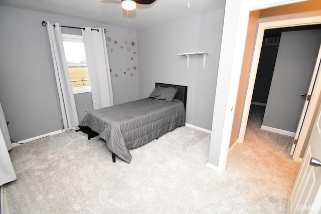 bedroom featuring ceiling fan and light colored carpet