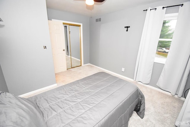 bedroom featuring carpet, a closet, and ceiling fan