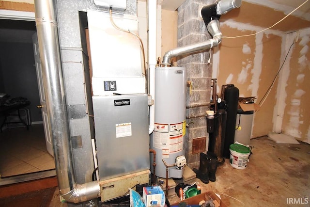 utility room featuring water heater