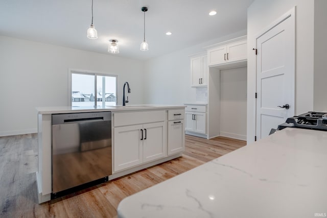 1173 Olympiada Knl, Fort Wayne, IN 46845 - kitchen featuring stainless steel dishwasher, a sink, light wood finished floors, pendant lighting, and white cabinets