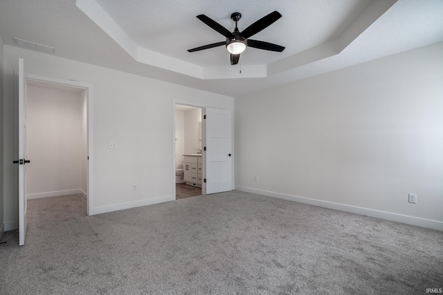 1173 Olympiada Knl, Fort Wayne, IN 46845 - unfurnished bedroom with a tray ceiling, carpet flooring, and baseboards