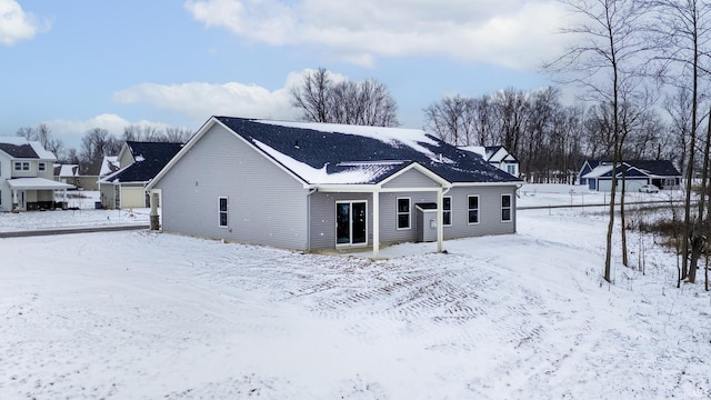 view of snow covered house