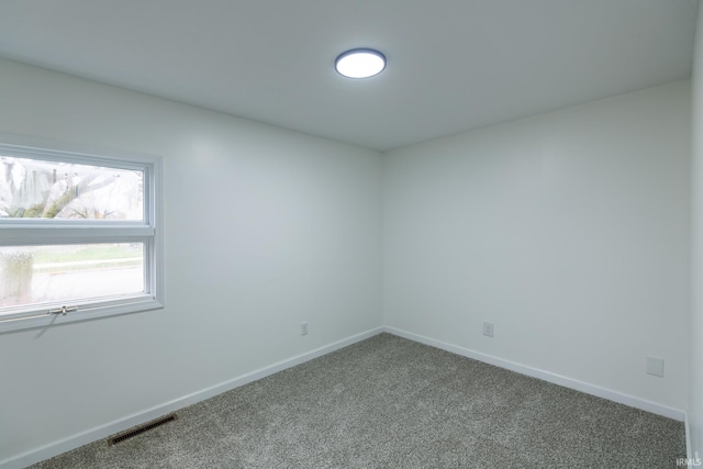 spare room featuring carpet floors