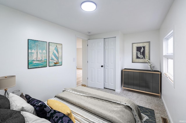 706 N Main St, Nappanee, IN 46550 - bedroom featuring baseboards, a closet, and carpet