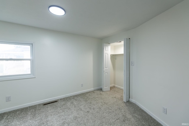 706 N Main St, Nappanee, IN 46550 - unfurnished bedroom featuring carpet floors, baseboards, and a closet