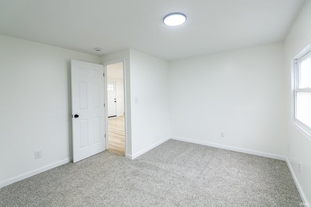 706 N Main St, Nappanee, IN 46550 - carpeted empty room with baseboards