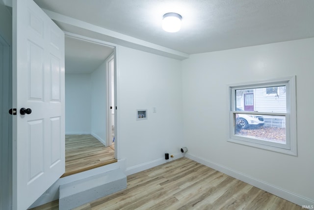 706 N Main St, Nappanee, IN 46550 - laundry room featuring light wood-style floors, washer hookup, and baseboards