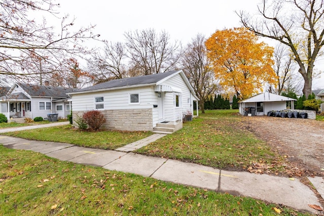 view of property exterior with a lawn and a carport