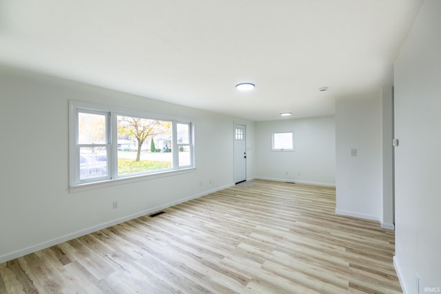 706 N Main St, Nappanee, IN 46550 - unfurnished living room featuring light wood-style floors and baseboards