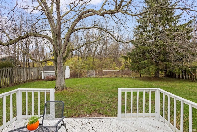 view of yard with a storage unit and a wooden deck