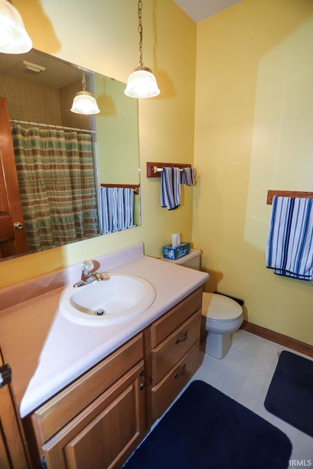 bathroom with vanity and toilet