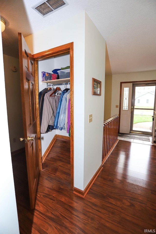 hallway featuring dark hardwood / wood-style flooring