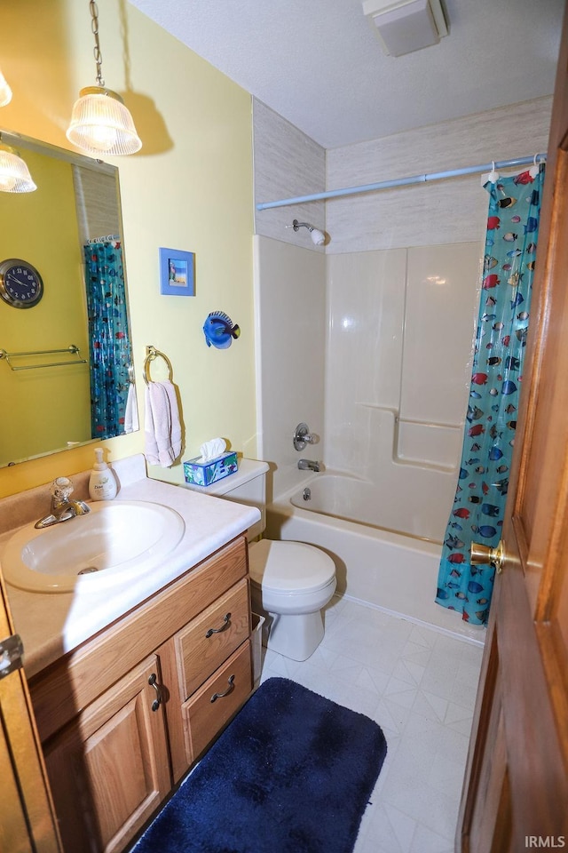 full bathroom with tile patterned floors, vanity, toilet, and shower / bath combo with shower curtain