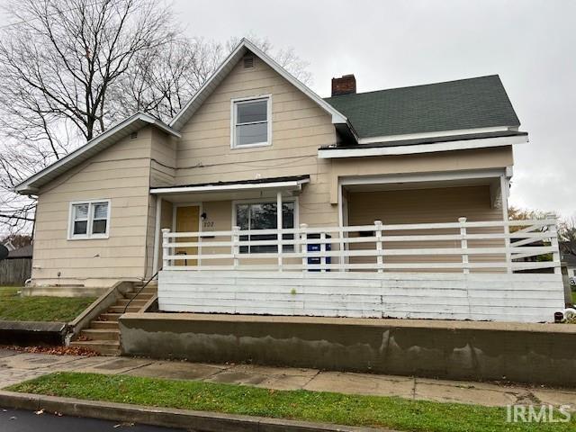 rear view of house with a porch