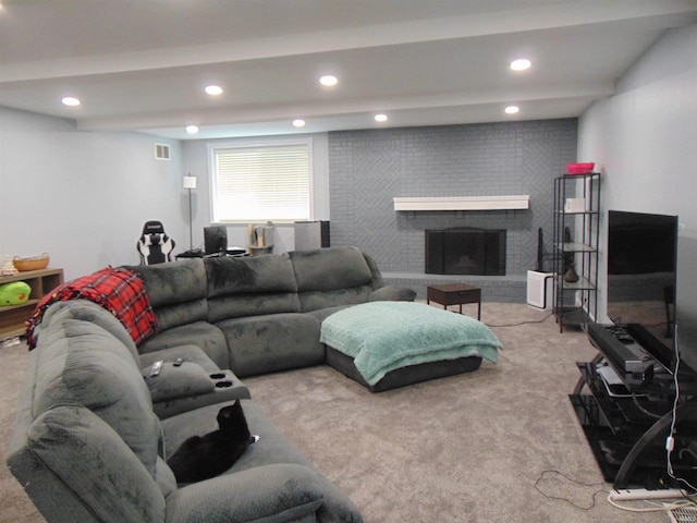 living room featuring carpet flooring and a brick fireplace