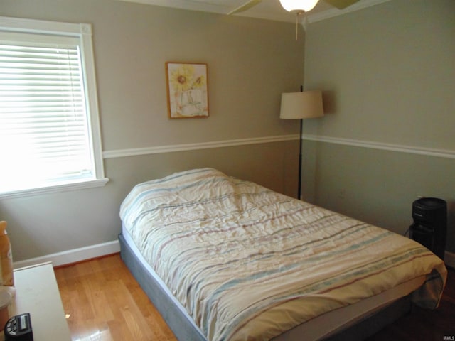 bedroom featuring ceiling fan and light hardwood / wood-style flooring