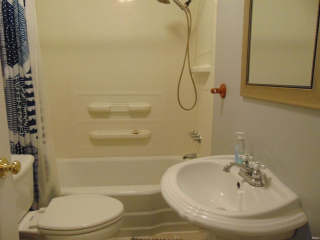 full bathroom with sink, shower / tub combo, and toilet