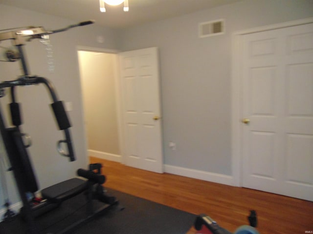 exercise area with hardwood / wood-style flooring