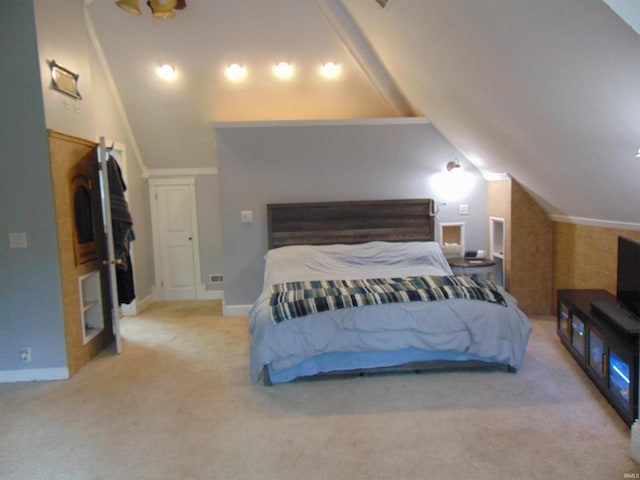 carpeted bedroom with vaulted ceiling