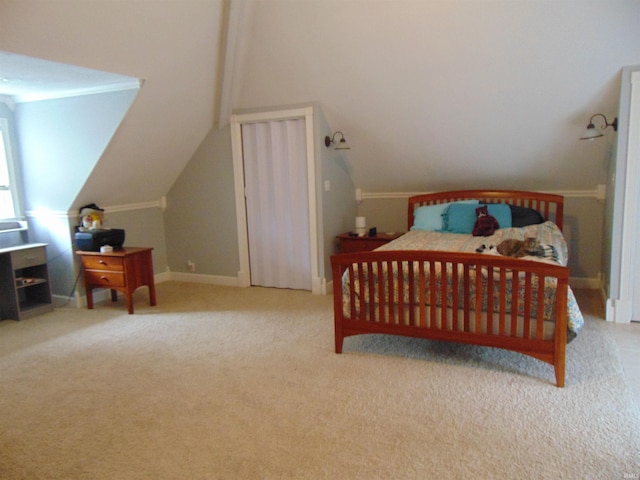 carpeted bedroom with vaulted ceiling