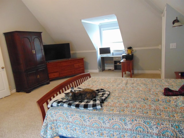 bedroom featuring light carpet and vaulted ceiling