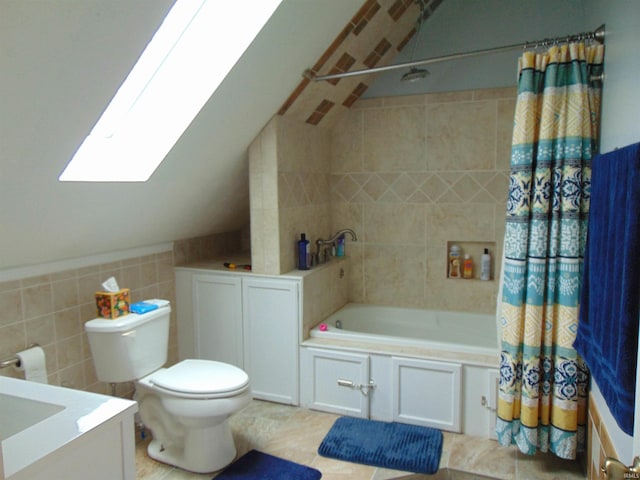 full bathroom featuring shower / bath combination with curtain, tile patterned floors, vanity, tile walls, and toilet