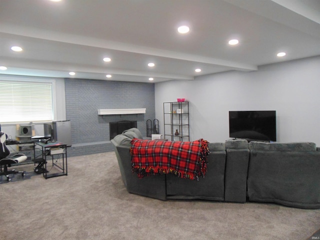 living room featuring beam ceiling, light colored carpet, and a brick fireplace