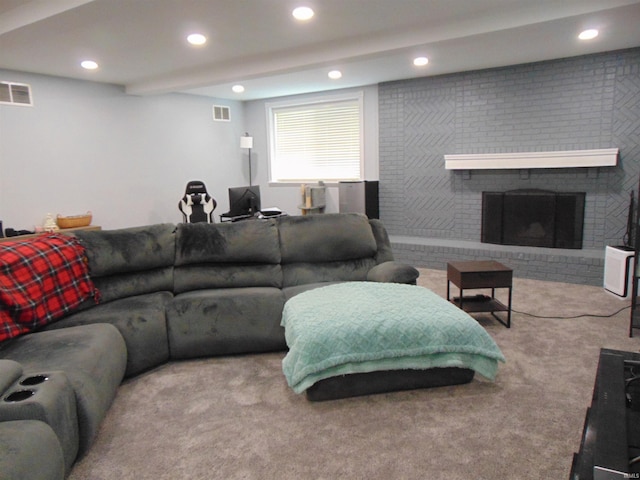 carpeted living room featuring a fireplace