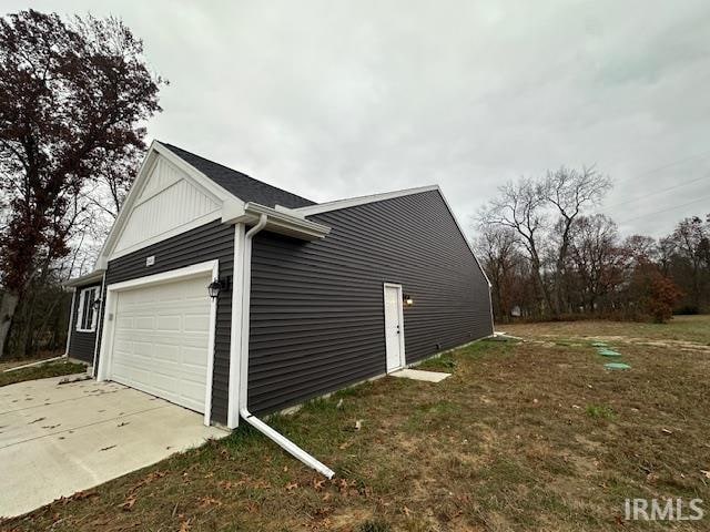 view of side of property featuring a garage